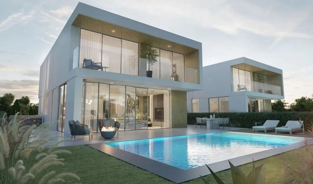 Render exterior da moradia ao entardecer com piscina iluminada